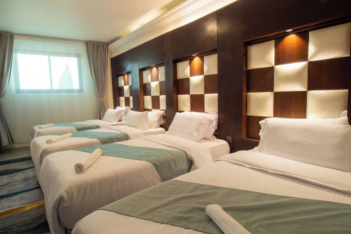 Apartment with two bedrooms (double - 4 single beds), living room, and balcony | Blackout drapes, bed sheets