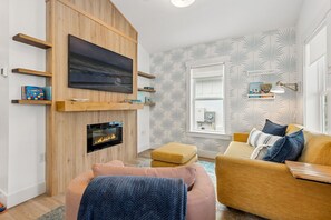 Smart TV, fireplace, books