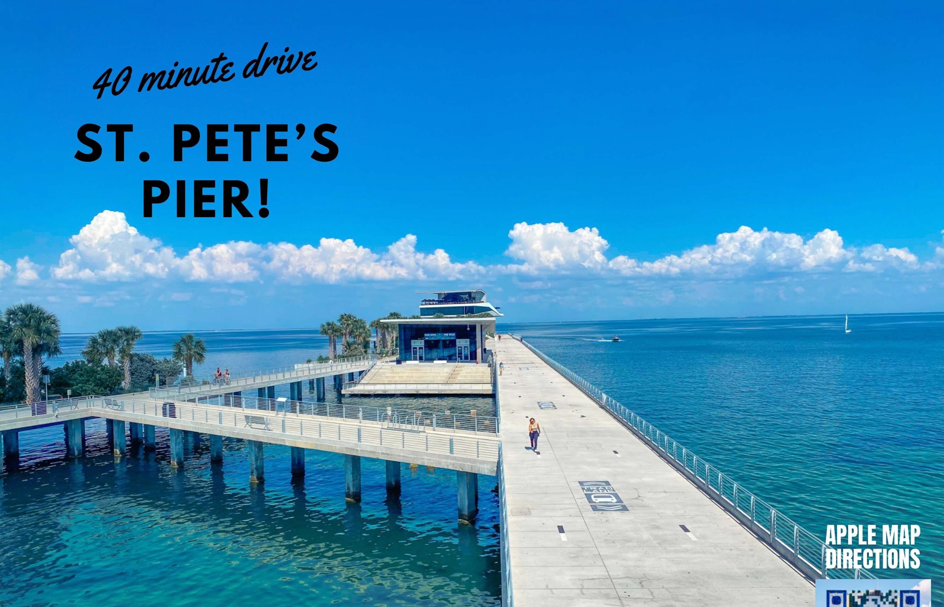 A pier extending into clear blue water with a small building at the end, labeled "ST. PETE'S PIER."