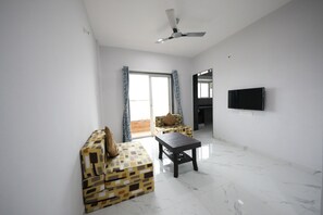 Premium suite, balkon, uitzicht op tuin | Woonruimte