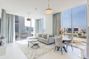 Deluxe Apartment, 1 King Bed, Balcony | Living area | Toys