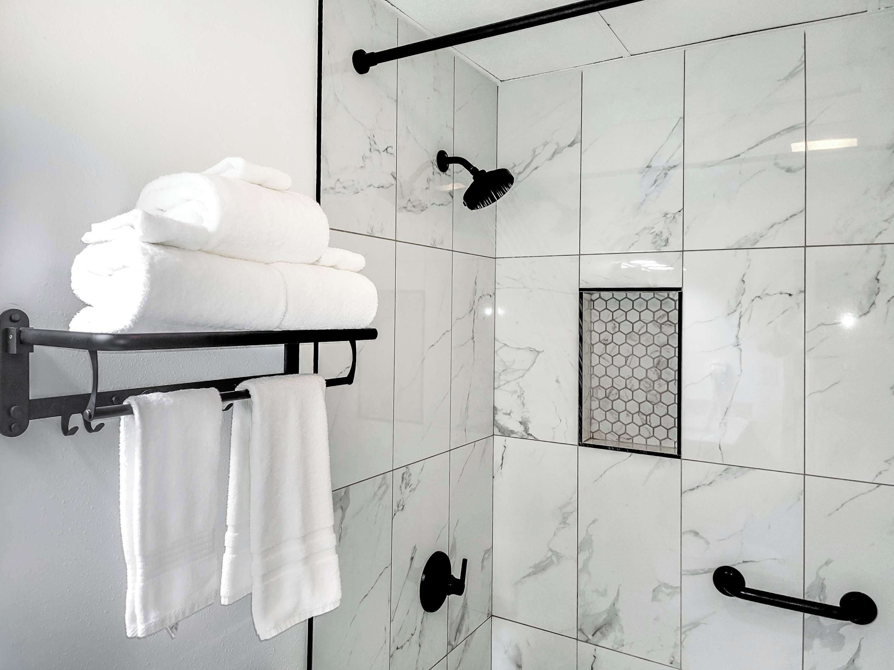 Shower, hair dryer, towels, shampoo