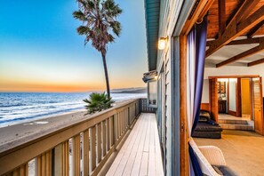 A wooden deck with a view of the ocean and a palm tree. - 25%Off Oct 30&31 On The Sand, Great Views/Reviews! (Ventura)