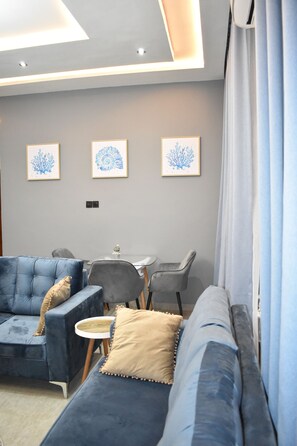 Smart TV, books - Masayi Residences 801 (Madina)