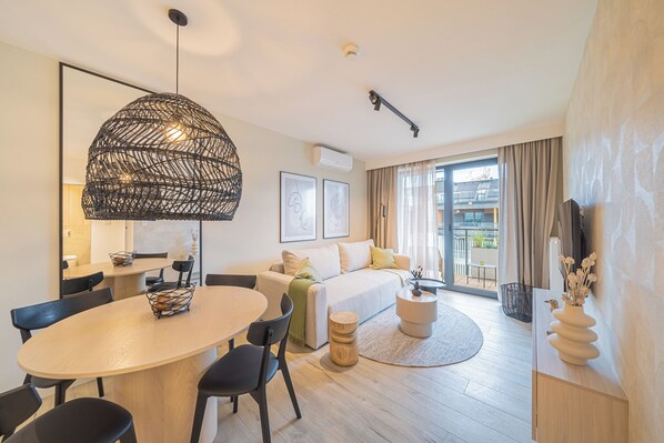 Premium Apartment, Kitchenette, Beachside | Laptop workspace, iron/ironing board, free WiFi