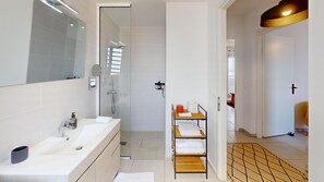 Shower, hair dryer, towels, soap