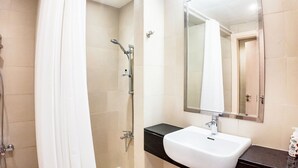 A bathroom with a shower, a sink, and a mirror. - Silk Valley-Prime located cozy studio (Abu Dhabi)