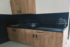 Fridge, stovetop, coffee/tea maker, dining tables