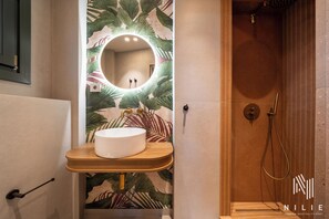 Shower, rainfall showerhead, hair dryer, towels