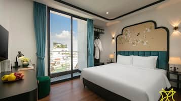 Deluxe Studio, Balcony, City View | In-room safe, desk, laptop workspace, blackout drapes