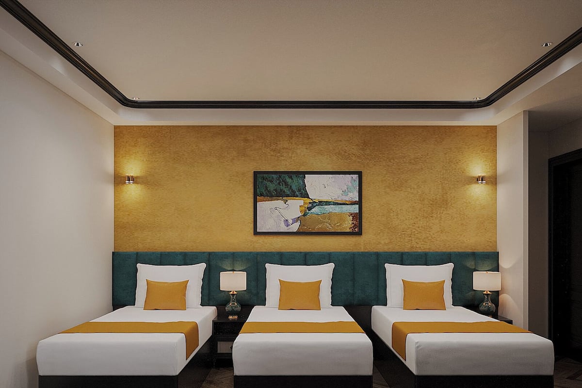 Deluxe Triple Room | In-room safe, desk, laptop workspace, blackout curtains