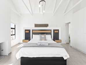 A modern bedroom with a large bed, bedside tables, a ceiling light, and a view of the outside. - Blueberry Villa (St. Helena Bay)
