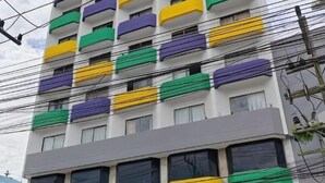 A multi-story building with balconies, power lines, and a grey facade. - INTERTOWER HOTEL (Su-ngai Kolok)