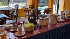 A restaurant counter with various dishes, a coffee machine, and a toaster. - INTERTOWER HOTEL (Su-ngai Kolok)