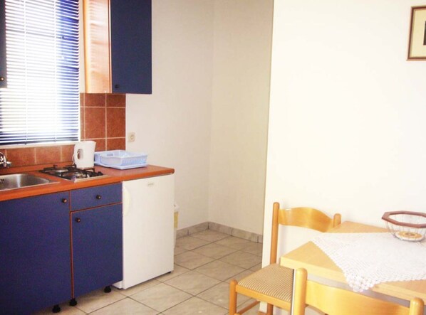 Apartment | Private kitchen | Fridge, microwave, stovetop, electric kettle - Apartments Antonio - One Bedroom Apartment With Terrace (Orebic)
