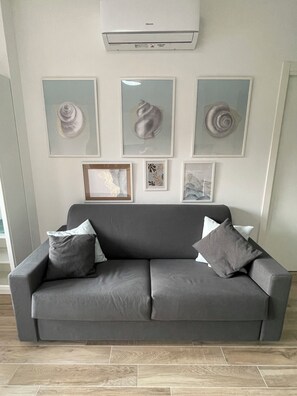 Apartment, 1 Bedroom | Living area | 30-inch TV with satellite channels - Acquamarina Stillness House by Wonderful Italy (Sanremo)