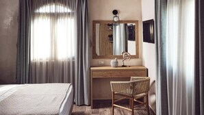 A bedroom with a wooden ceiling, a bed, a desk with a chair, and a large mirror. - Casa Di Pietra - Four Bedroom Villa, Sleeps 8 (Zakynthos)