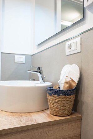 Shower, eco-friendly toiletries, hair dryer, slippers