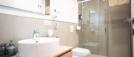 Shower, eco-friendly toiletries, hair dryer, slippers