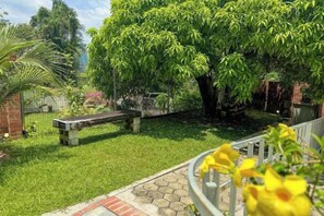 A garden with a bench, a tree, and a pathway. - Gathering l Wedding House l 18PaxTaman Oug KL (Kuala Lumpur)