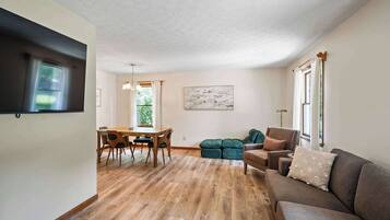 House, Multiple Beds, Hot Tub, Garden View (The Family Nook) | Living area | 50-inch flat-screen TV with digital channels