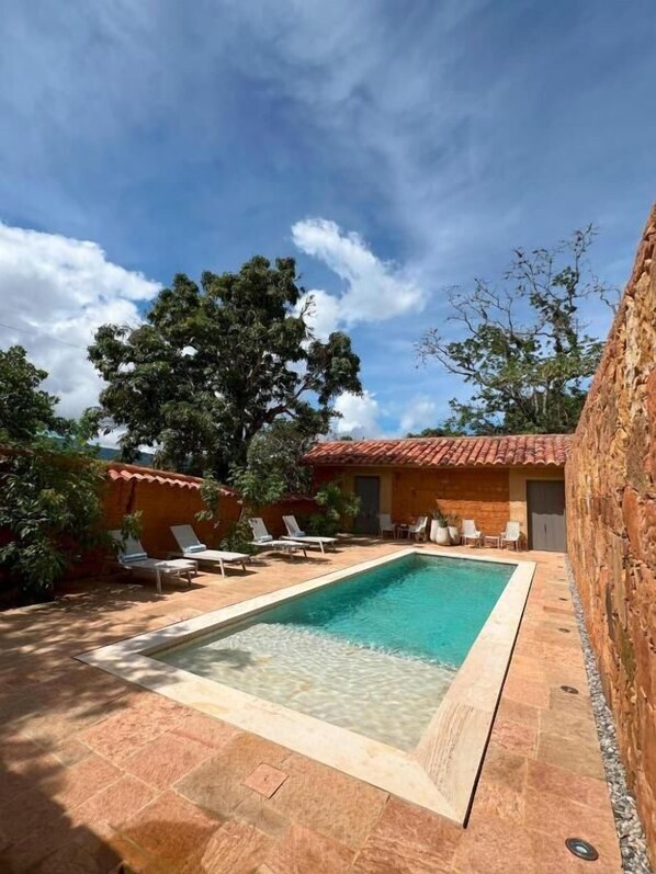 Outdoor pool, open 8:00 AM to 8:00 PM, sun loungers