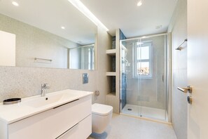 Shower, hair dryer, towels, soap