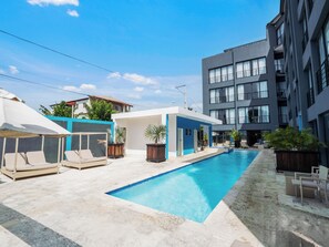 Outdoor pool - Modern 1BR at Rizz Suites • Pool Access • Walk to Beach • King Bed• Strong AC (Sosúa)