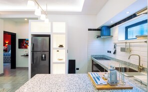 Fridge, microwave, stovetop, coffee/tea maker