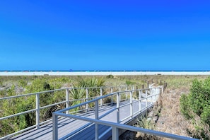 A wooden boardwalk leading to a beach with clear skies. - Huge Heated Pool ❤ Short Walk to the Beach, ride FREE Trolley around the Key! (Siesta Key)