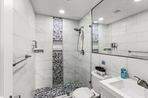 Shower, hair dryer, towels, soap