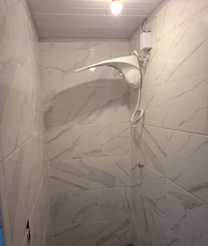 Shower, towels, soap, toilet paper