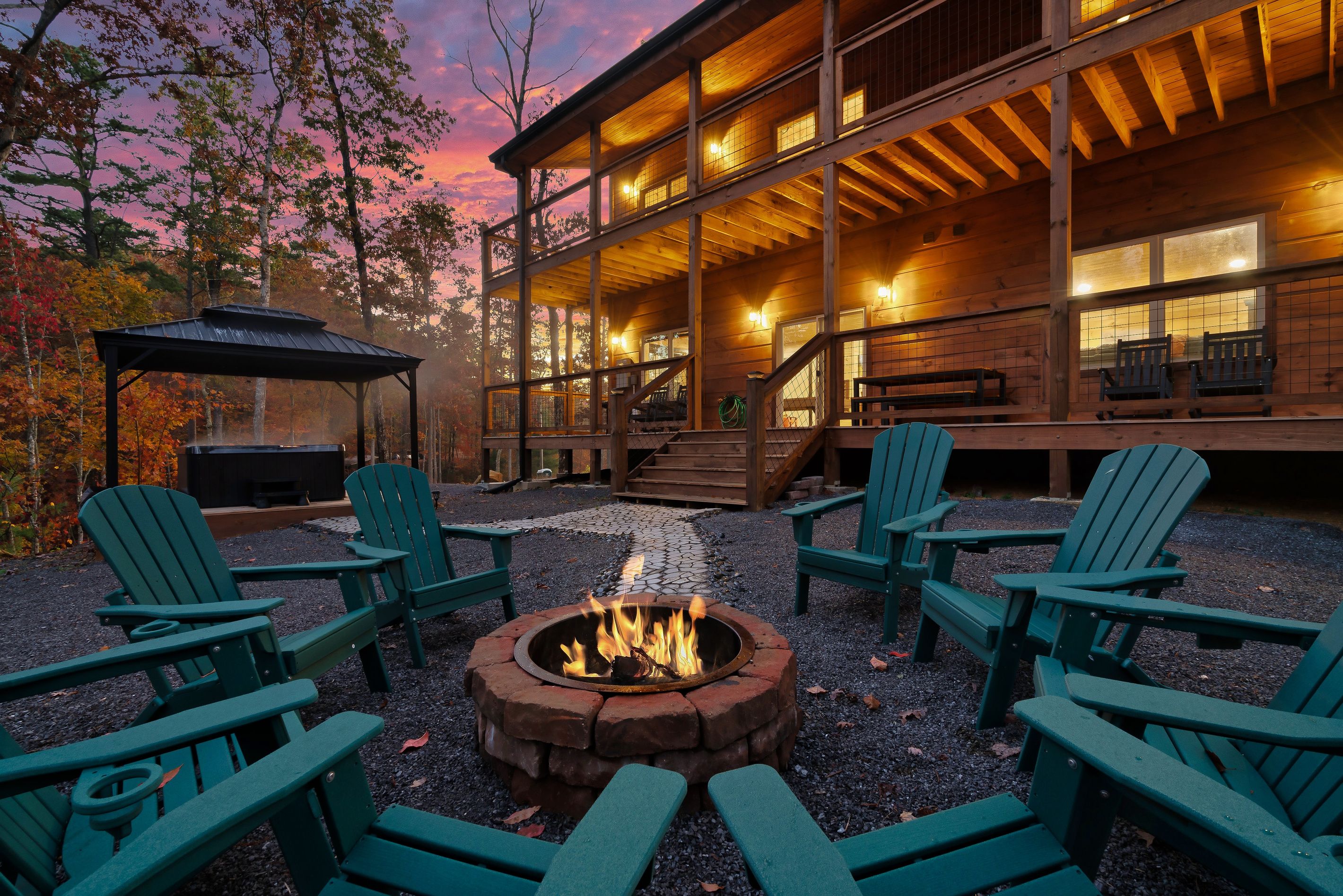 A lodge with outdoor seating and a fire pit.