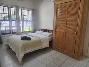 Luxury Apartment, 4 Bedrooms, Patio, Courtyard View | Individually furnished, iron/ironing board, free WiFi, bed sheets - Ideal Executive Suites (Georgetown)