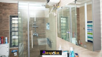 Combined shower/tub, slippers, towels, soap