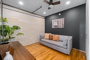 TV - Midcentury Modern loft in Castleberry Hill with patio, parking & sleek updates. (Atlanta)