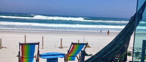 On the beach, sun loungers