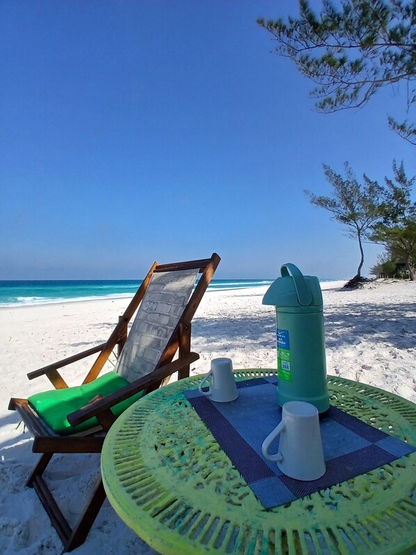 On the beach, sun-loungers