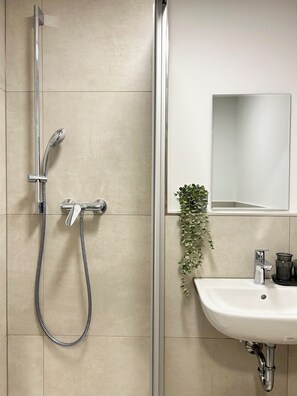 Shower, towels, soap, toilet paper
