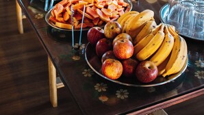 A buffet table with various food items and utensils. - Espaço Flor das Águas  (Cunha)