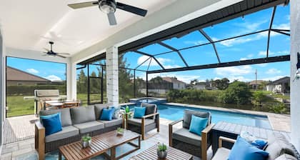 BRAND NEW- Gulf access electric heated pool home sleeps up to 13 guests