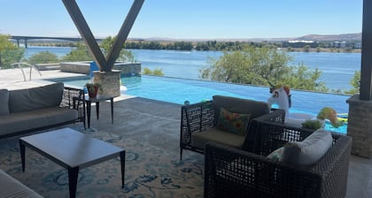River Front Property with boat dock, basketball court and Pool