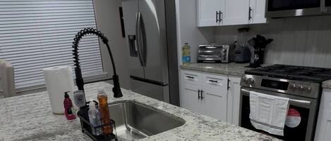 Fridge, toaster, blender, cookware/dishes/utensils