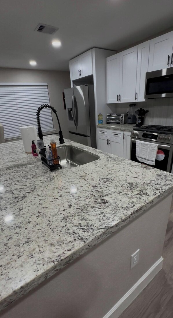 Fridge, toaster, blender, cookware/dishes/utensils