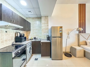 Fridge, stovetop, dishwasher, coffee/tea maker