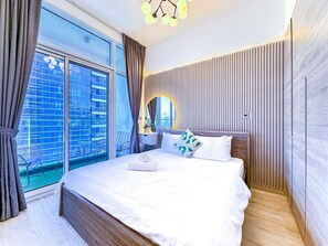 1 bedroom, desk, iron/ironing board, travel crib