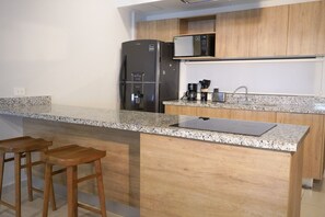 Microwave, coffee/tea maker, toaster, cookware/dishes/utensils