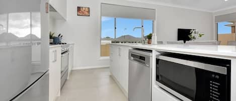 Coffee/tea maker, fridge, microwave, oven