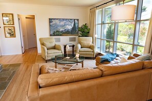 Smart TV, fireplace, books, computer monitors