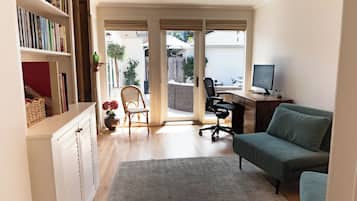 Smart TV, fireplace, books, computer monitors